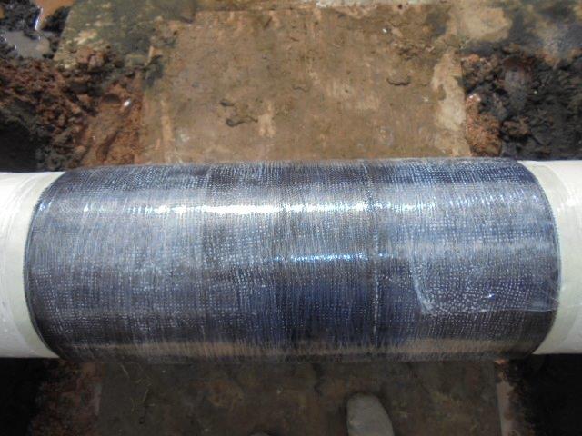 A 3-ft (1-m) section of damaged pipeline was covered with 24 layers of composite solution and overwrapped with compression film, which was perforated to allow the composite underneath to completely cure.
